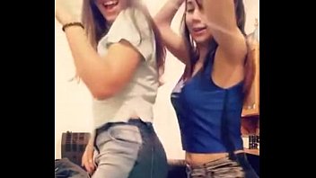 two gals dancing together